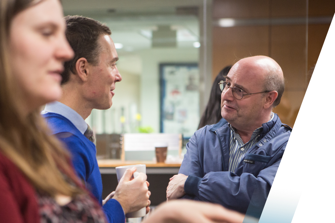 Men talking at event