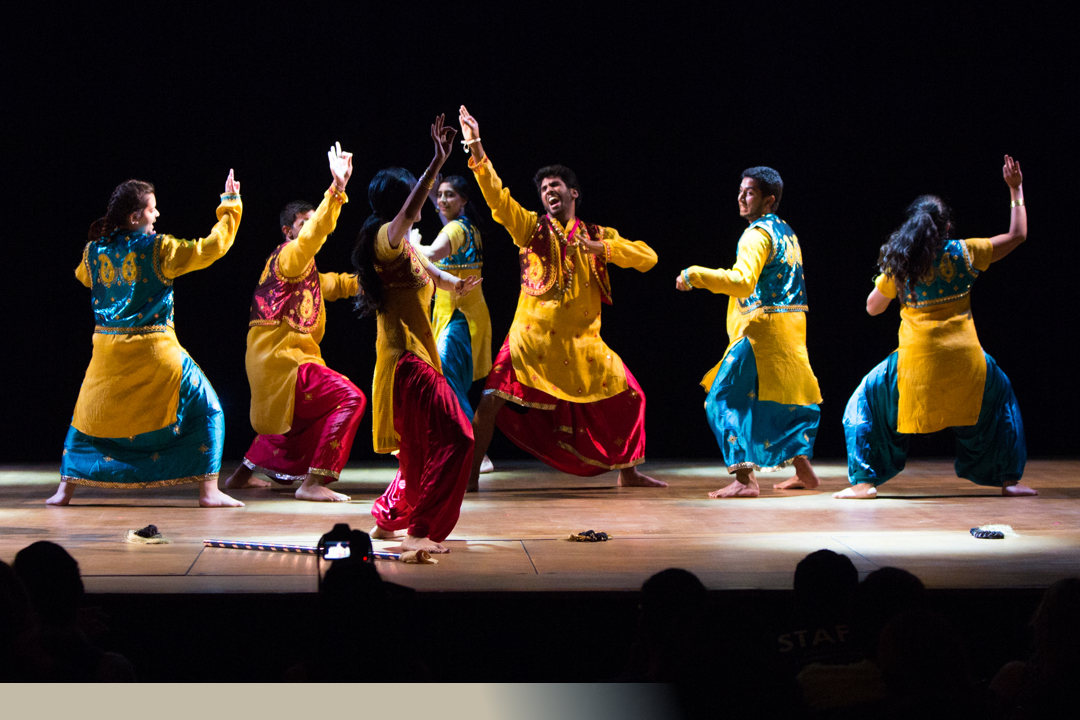 Student group dancing on stage