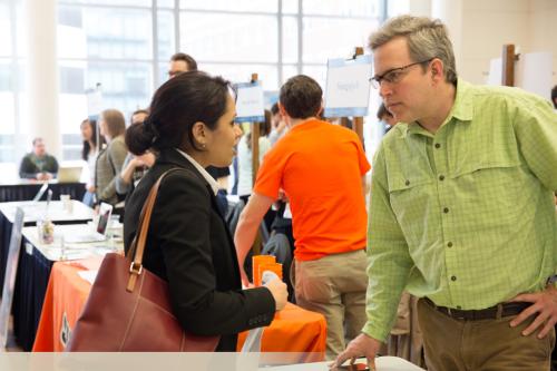 Man and woman talking at networking event